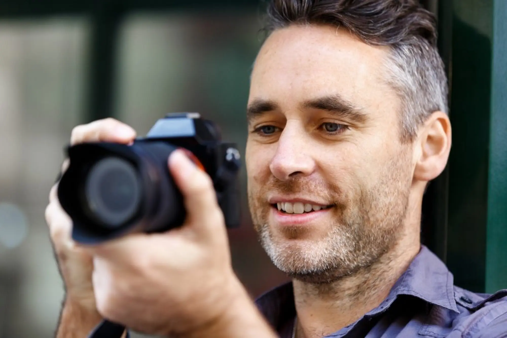 male-photographer-taking-picture-PQ3PLLL-Custom.jpg